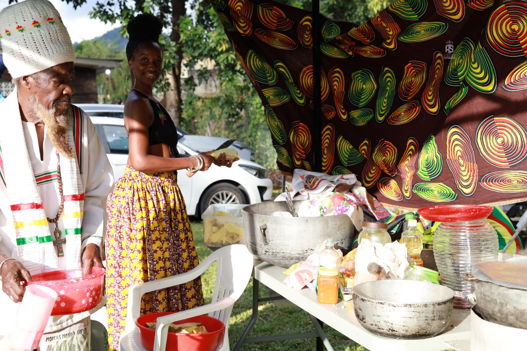 Community food preparation and cultural showcase at a Vital Ital Life gathering.